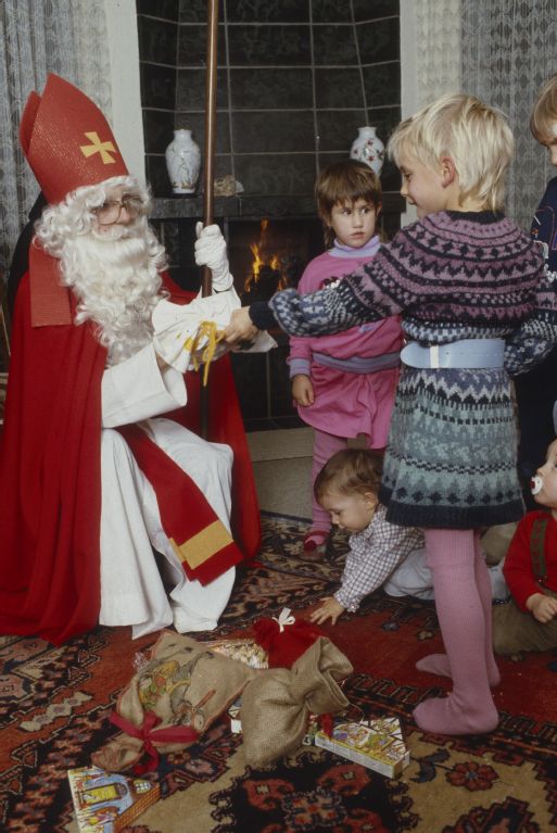 Santa Claus with mischief and angel