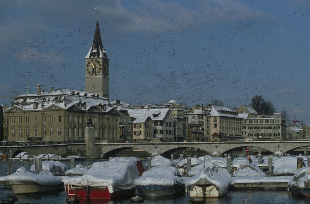 Zurich in winter, Münsterbrücke and St. Peter's church tower