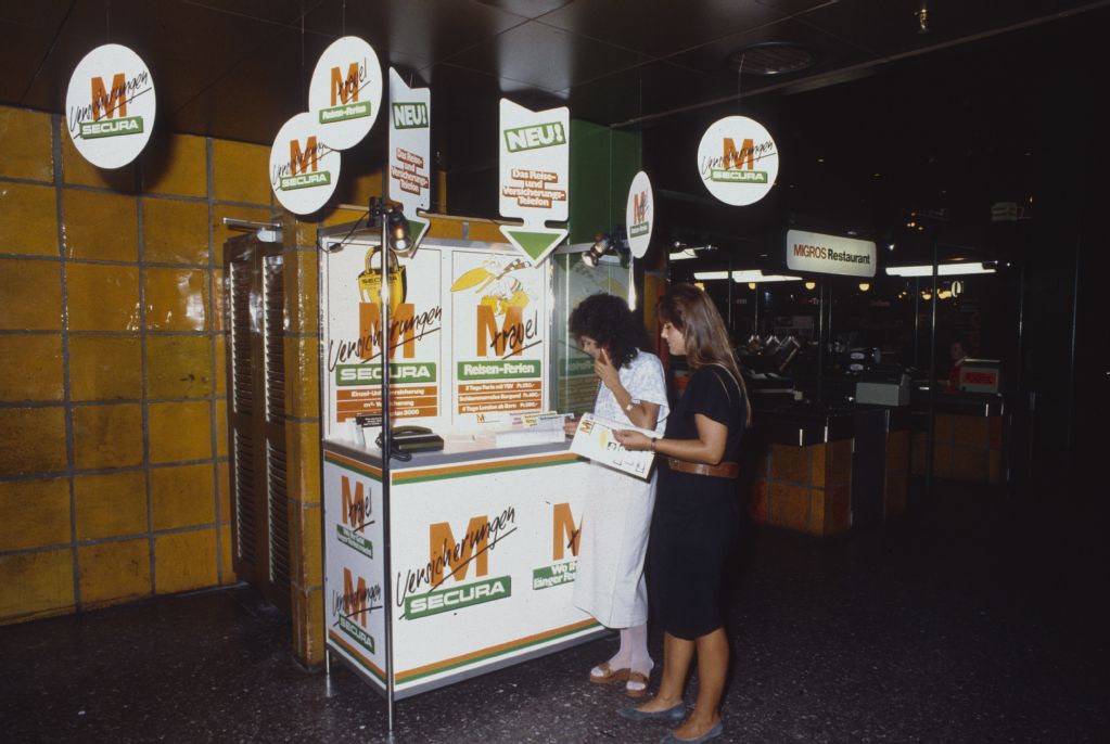 Migros, Secura insurance, travel agency, information desk with telephone
