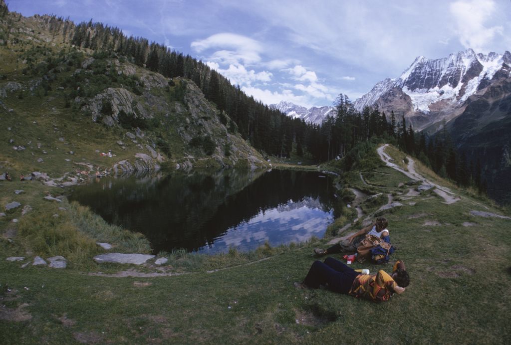Blatten, hikers taking a break at Schwarzsee lake