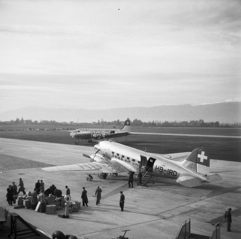 Cargo unloading from Douglas DC-4-1009 A, HB-ILA "Genève" in Geneva-Cointrin