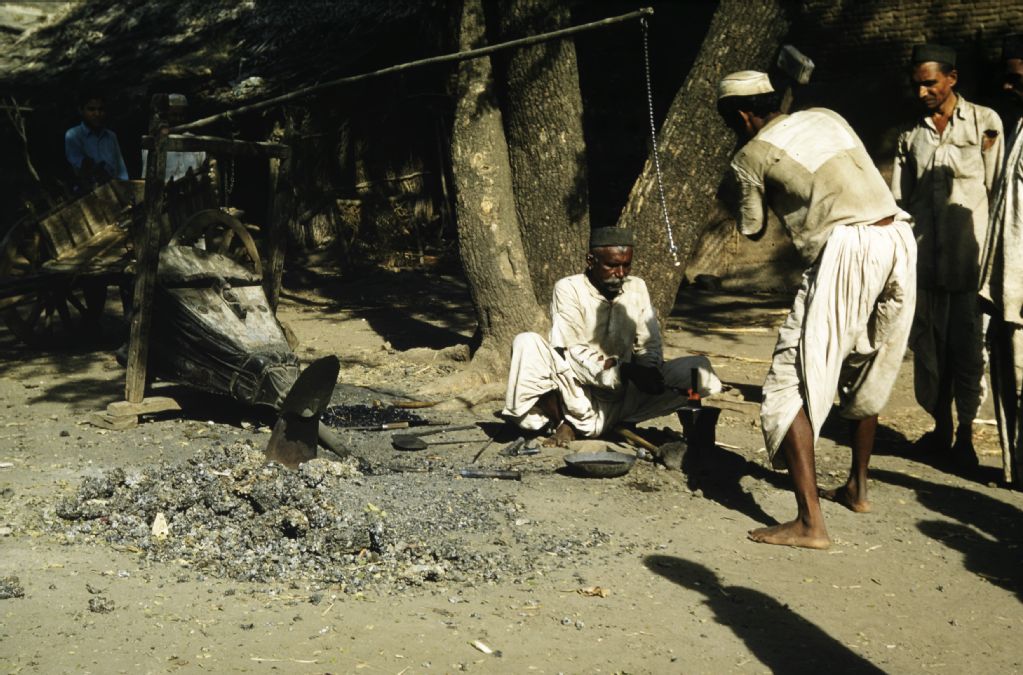 Men forging, India