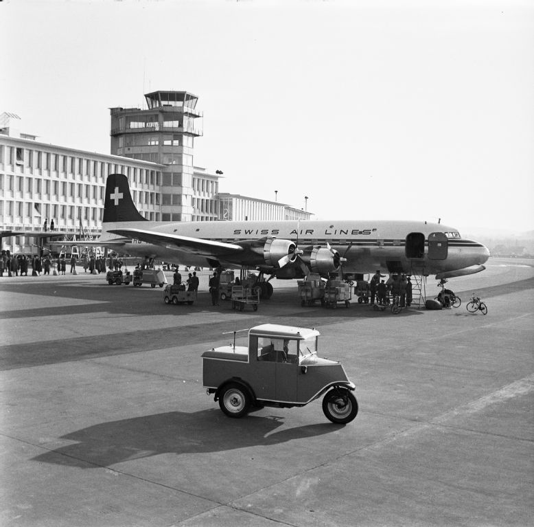 Swissair's Douglas DC-4 in front of the control tower at Zurich-Kloten
