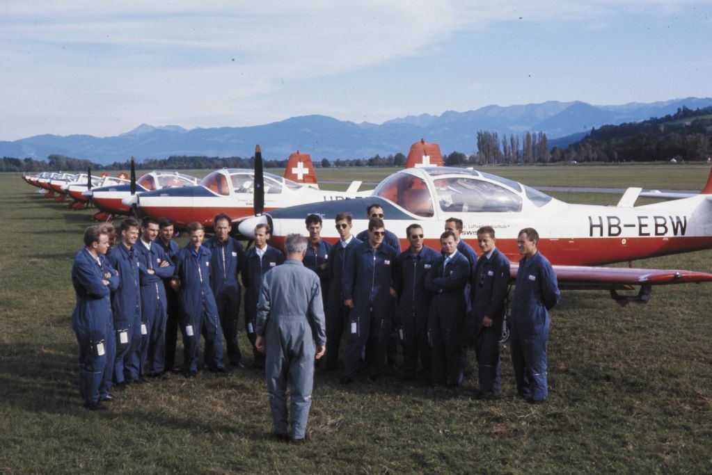 Pilot class of the Swiss Air Transport School Swissair in front of a Piaggio P149E at the airfield St. Gallen-Altenrhein
