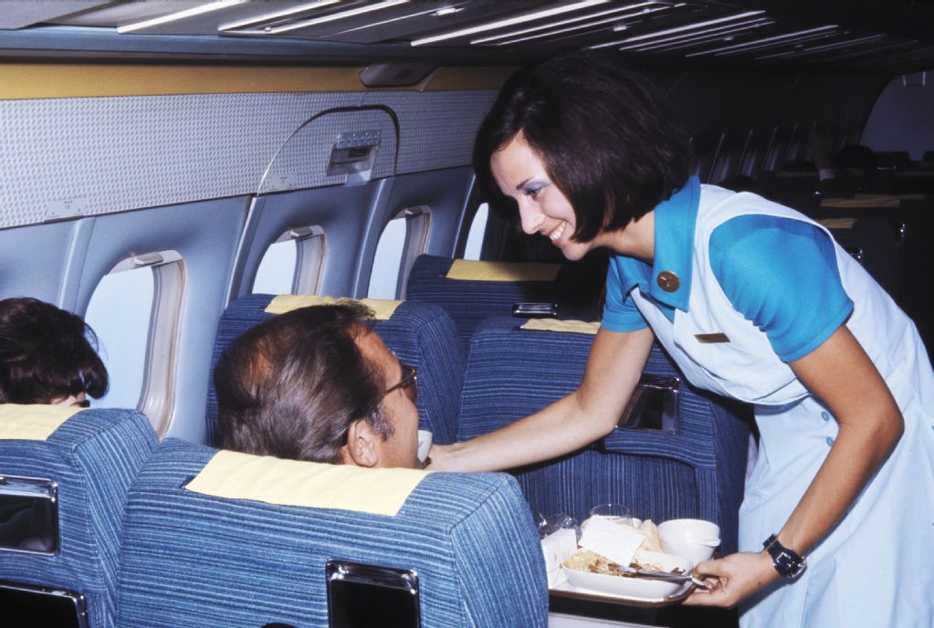 Onboard service in the economy class cabin of a Douglas DC-9-15 of Swissair