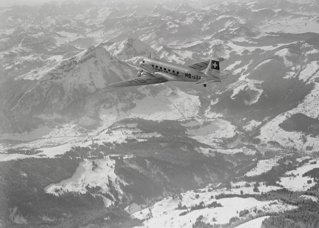 Douglas DC-2 115-B, HB-ITI in flight over the foothills of the Alps with Mythen