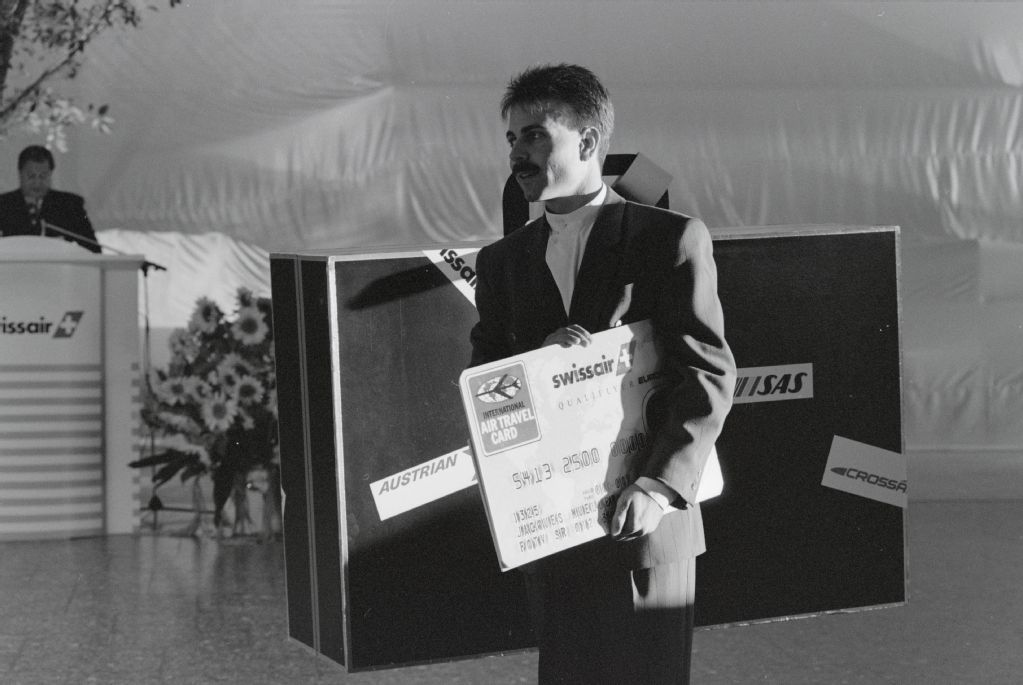 Unknown person with suitcase dummy at the official opening ceremony of the "Swissair Terminal" in Zurich-Kloten