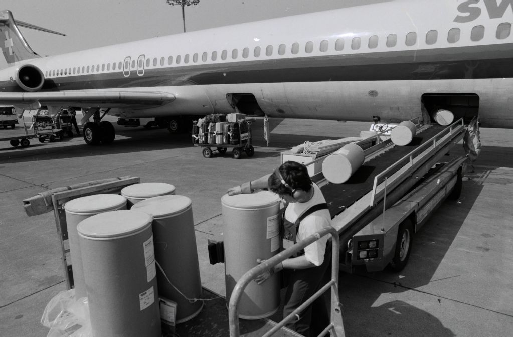Cargo loading into the McDonnell Douglas DC-9-81, HB-INK "Opfikon" at Zurich-Kloten