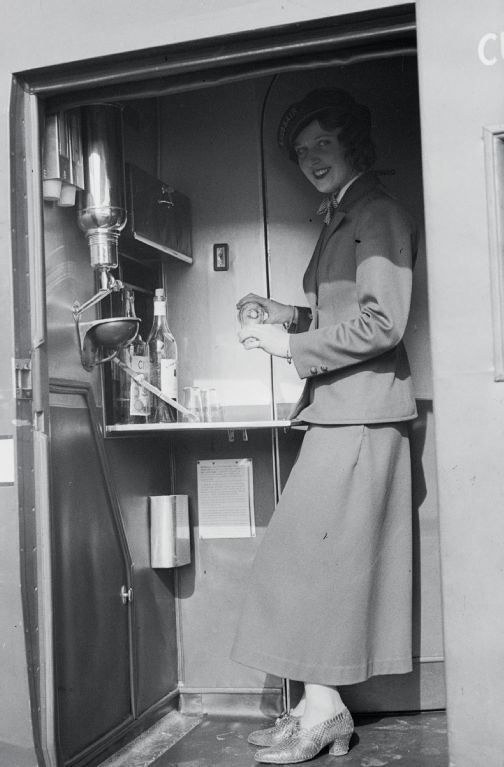 Miss Nelly Diener in the galley of the Curtiss AT-32C Condor, CH-170 in Dübendorf