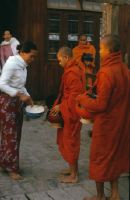 Burma, Mandalay, mendicant monks receive morning offering