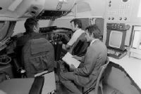 Oxford, Swissair pilot training, jet trainer, three men in a cockpit simulator
