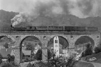 Rümlingen (BL), 120 years old Hauenstein line, steam train with historic rolling stock on the bridge, steam locomotive Ec 2/5 No. 28 "Geneva