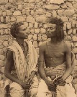 Nubia, two young bishari in front of stone wall