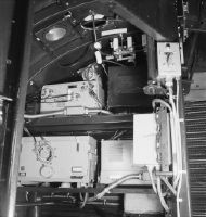 Electrical and radio equipment between cockpit and cabin, usually behind the insulation mat