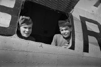 Swissair baggage boys in the hatch of the baggage compartment of a Douglas DC-3 of Swissair in Dübendorf
