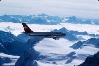 Airbus A310-221, HB-IPD "Solothurn" in flight over the Tête Blanche and the Aosta Valley in fog, looking south-southwest (SSW)