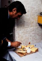 Purser preparing a cheese platter in a Douglas DC-10 of Swissair