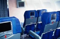 Seats with screens in the empty economy class cabin of an Airbus A330 of Swissair