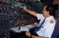 Flight engineer Roger Barraud in the cockpit of a Swissair Boeing 747-357