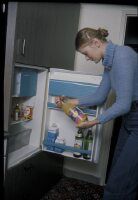 Woman at refrigerator