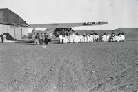 Group of children in front of Fokker F.VII b-3m, CH-166 (HB-LAO)