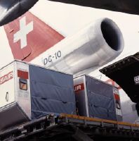 Loading cargo containers into a McDonnell Douglas DC-10 of Swissair