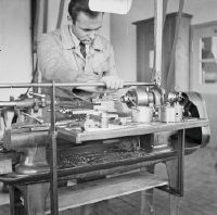 Mechanic at the lathe in the Swissair workshop at the airfield in Dübendorf