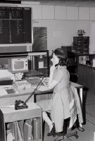 Swissair employee on the phone in an office