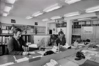 Employees performing engine troubleshooting in an open-plan office at Swissair in Zurich-Kloten