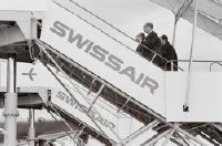 Passengers on the boarding stairs of a wide-bodied Swissair aircraft at Zurich-Kloten