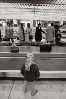 Passengers at the baggage claim/customs hall at Geneva-Cointrin airport