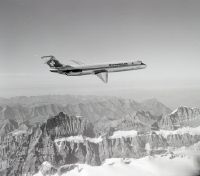McDonnell Douglas DC-9-51, HB-ISS "Dietikon" in flight over Petersgrat and Kanderfirn in the Bernese Alps, looking northwest (NW)