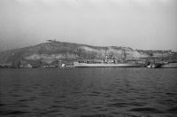 USS Altair (AKS-32), a US Navy fleet supply ship in front of Castell de Montjuïc.