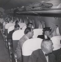 Flight with Douglas DC-4-1009 A, HB-ILI "Basel/Schwyz" over the Alps on the occasion of Edwin Schwarzenbach's retirement from the Swissair Board of Directors: passengers in the cabin