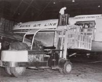 Cargo loading into a Swissair Douglas DC-4 at Zurich-Kloten