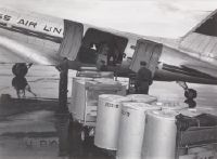 Barrels loaded into a Swissair Douglas DC-3 freighter at Zurich-Kloten