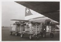Cargo loading into the Douglas DC-4-1009 A, HB-ILI "Schwyz" at Zurich-Kloten