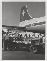 Freight loading of birds into the Douglas DC-6B-1225, HB-IBI "St. Gallen"